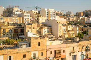 Fototapeta premium traveling the beautiful streets of Malta with old historical and new modern buildings