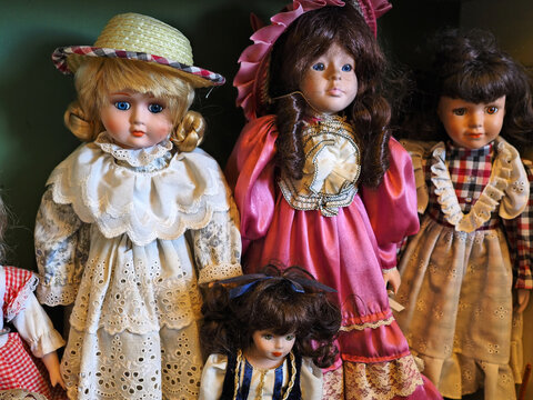 Old and vintage play dolls in antique shop