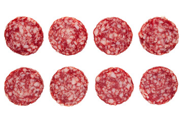 Round slices of sausage isolated on white background, top view. Set of uncooked smoked sausages on...