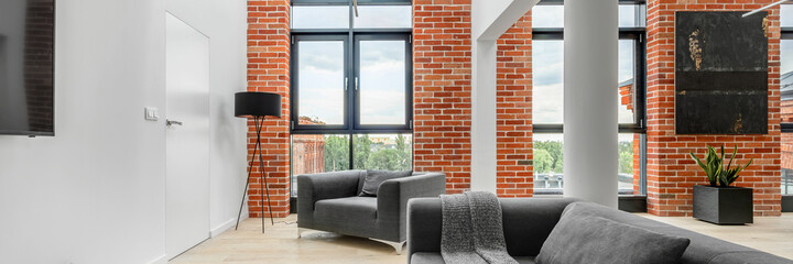 Living room in loft apartment, panorama