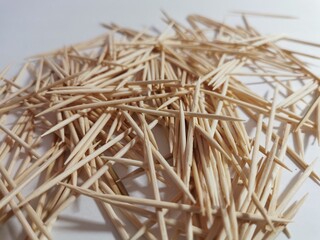 wooden toothpicks yellow on a white background a lot