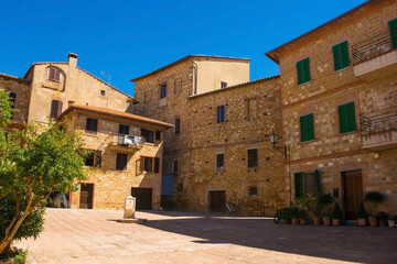 Fototapeta na wymiar A residential square in the historic old town of the village of Pienza in Siena Province, Tuscany, Italy 