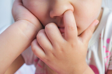 nose picking. Child picking his nose