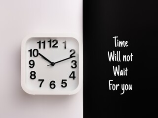 Inspirational quote.Time will not wait for you with alarm clock on white and black background.