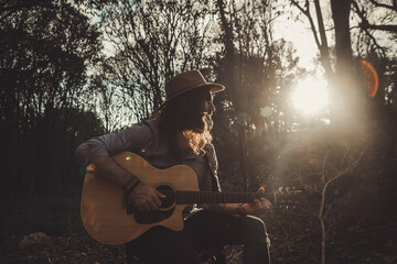 portrait in a field of a musician man