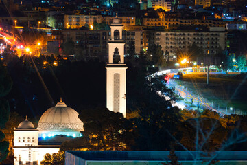night view of the town of setif algeria with a lot of lighting and the mosque with the road - obrazy, fototapety, plakaty