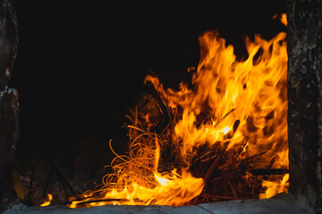 Burning fire in a stove in a Chinese temple for Chinese New Year celebration