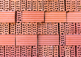Pile of arranged red bricks
