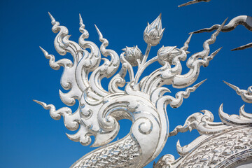 Obraz premium Art Sculpture at Wat Rong Khun, as known White Temple, is Buddhist temple in Chiang Rai Province, Thailand