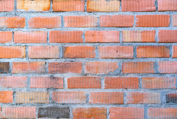 Orange color brick wall for brickwork background design