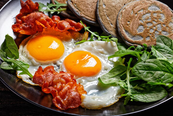 buckwheat pancake with fried Eggs and bacon