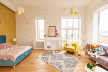 Scandinavian style apartment interior. bright yellow warm colors. wooden flooring. sunlight in large windows.