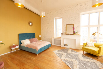 Scandinavian style apartment interior. bright yellow warm colors. wooden flooring. sunlight in large windows.
