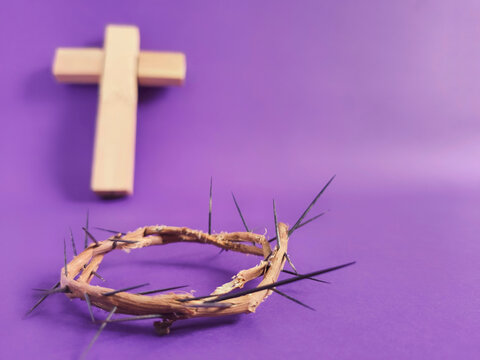 Lent Season,Holy Week and Good Friday concepts - photo of crown of thorns in purple vintage background. Stock photo.
