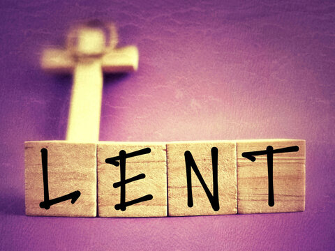 Lent Season,Holy Week and Good Friday concepts - LENT text on wooden blocks in purple vintage background. Stock photo.
