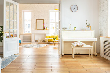 very light and sparcious two-rooms apartment in scandinavian design style with fashion furniture and large windows. warm colors during day time