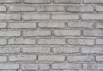 Background of old vintage dirty brick wall with peeling plaster, texture