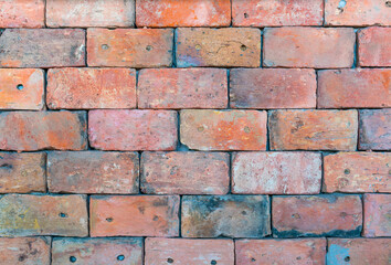 Orange color brick wall for brickwork background design