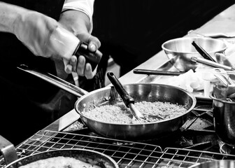 Chef cooking in a kitchen, chef at work, Black and White.