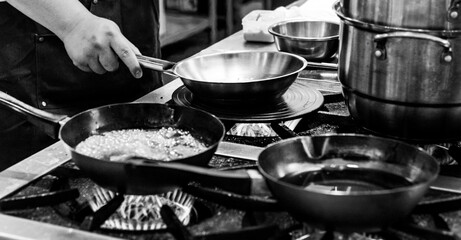 Chef cooking in a kitchen, chef at work, Black and White.