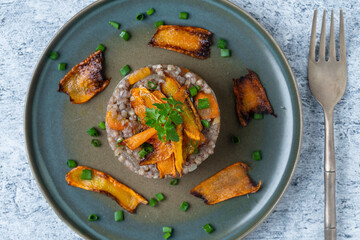 Boiled buckwheat with fried carrots and onions, close up