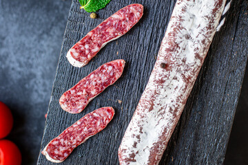 sausage fuet smoked or dry-cured salami delicious meat ready to cook and eat on the table for healthy meal snack outdoor top view copy space for text food background rustic image