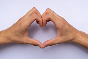 man's hands forming a heart, valentine's day