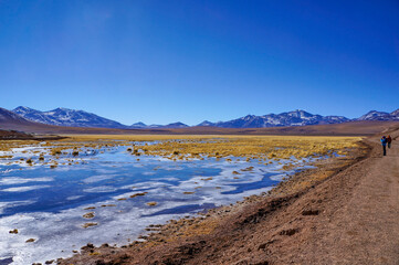 People admiring the view at Vado Rio Putana in the Atacama Desert, Antofagasta, Chile