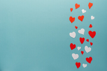 paper hearts on a blue background top view