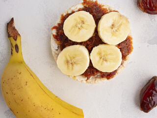 Rice cakes with dates and banana close up top view