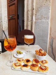 Aperitif in the city of Noto in Sicily. Spritz with Aperol and draft beer.
