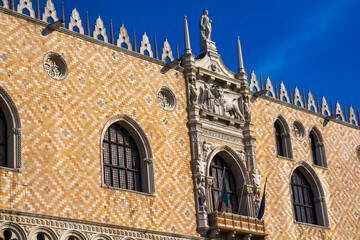 Ornate facade at southern side of Doge Palace on San Marco square in Venice, Italy