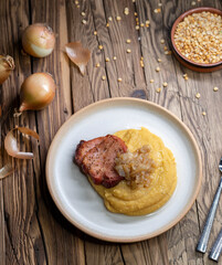 Czech cuisine, smoked meat with pea porridge and fried onion until golden