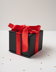 Black gift boxes with red ribbon on white background. The Concept Of Valentine's Day.