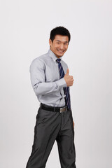 A young business man standing in a shirt 