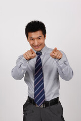 A young business man gesturing in a shirt 