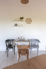 stylish kitchen interior design. white walls and wooden decoration. beautiful hammock and high windows.