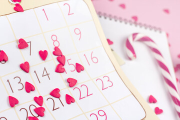 Calendar sheet with valentine's day date and red hearts.