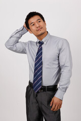 A young business man gesturing in a shirt 