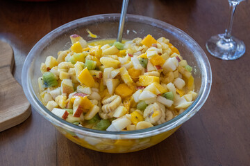 View of Brazilian fruit salad on wooden background