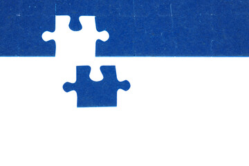 piece of blue jigsaw puzzle on a white background, the concept of the end of a big hard work, the solution of the problem, the final touch