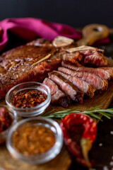 ham and seasonings on a wooden table.