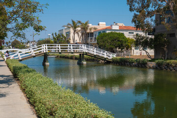 Fototapeta na wymiar Beautiful view of a bridge across the canals of Venice Beach in California