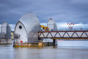 Long exposure view Thames barrier, a retractable barrier system designed to prevent the floodplain...