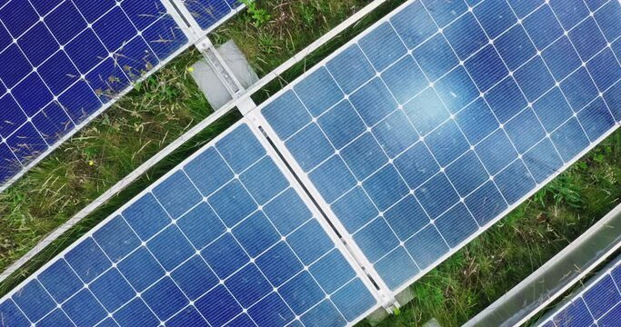 Aerial drone shot of solar panels on top of modern apartment building sunlight