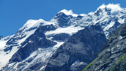 Fototapeta na wymiar Mountain landscape along the road to Stelvio pass at summer. Glacier