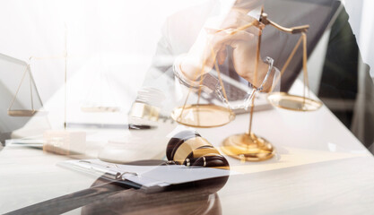 Business and lawyers discussing contract papers with brass scale on desk in office. Law, legal services, advice, justice and law concept picture with film grain effect