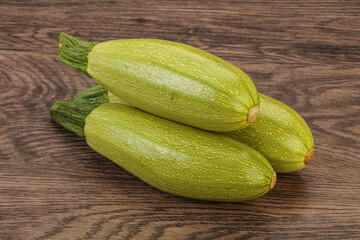 Young tasty zucchini over board