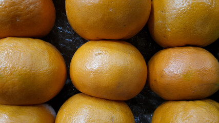 Fresh citrus fruit with orange color in a traditional market, Indonesia