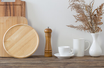kitchen utensils on  wooden shelf in  white kitchen